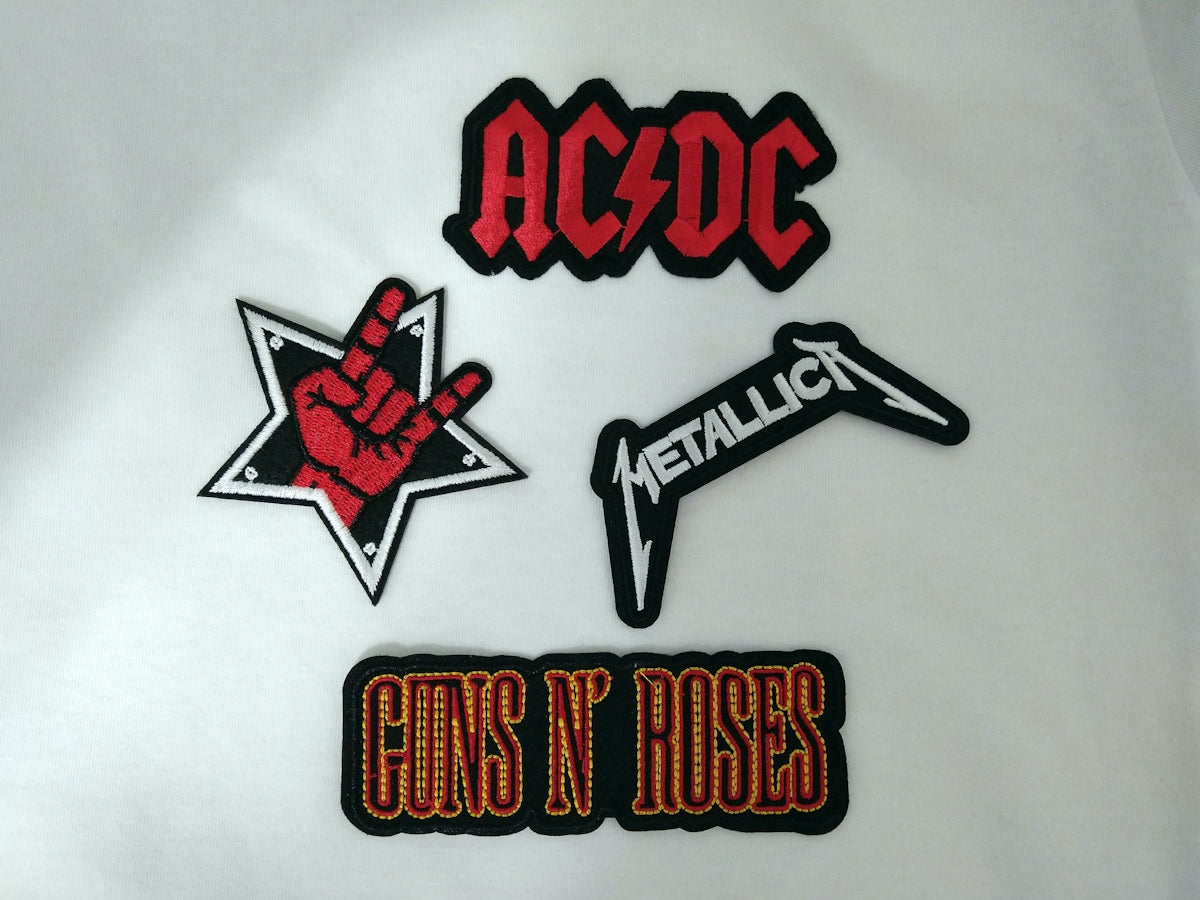 Image of a group of stickers that say guns n roses